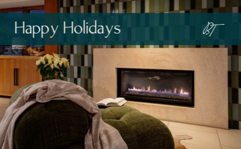 Happy Holidays banner in front of Beach Terrace fireplace