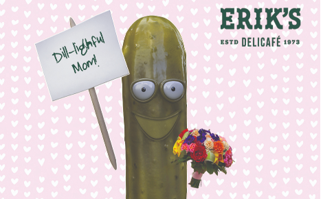 Smiling pickle holding colorful bouquet of flowers with a sign that reads "Dill-lightful Mom" with a pink heart background and Erik's logo