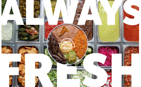 Overhead view of a colorful salsa bar with trays of fresh ingredients including sauces, chips, grilled peppers, and vegetables. Bold white text reads ‘ALWAYS FRESH,’ with a circular plate of beans, rice, guacamole, and chips in the center featuring the Taco Palenque logo.