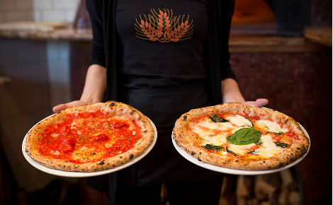 HOLDING PIZZAS