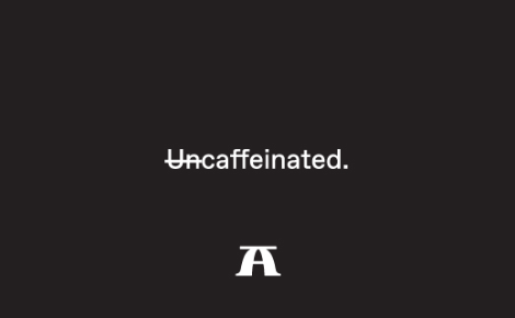 Black background with white text that reads "Uncaffeinated." but the "Un" is crossed out.