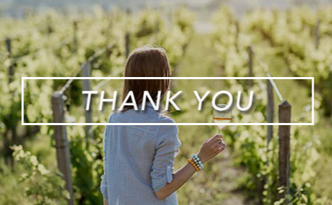 eGift card image of a lady holding a wine glass in a vineyard