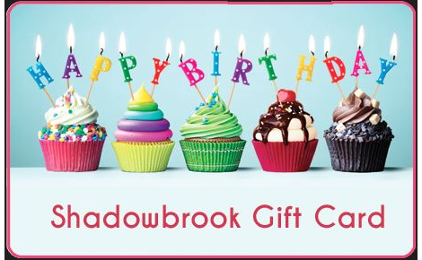 Happy Birthday candles on cupcakes. Colorful with sky blue background