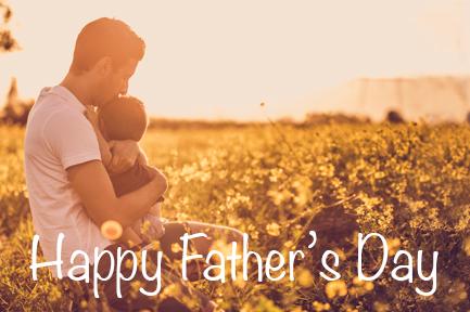 Image of father and son hugging in a field at sunset with the text 