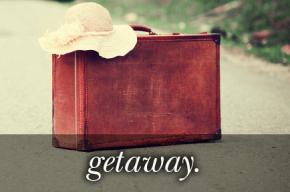 Image of a red suitcase wit the text 
