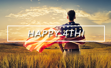 Gift card image of man standing in a field with the American flag wrapped around him and the text 