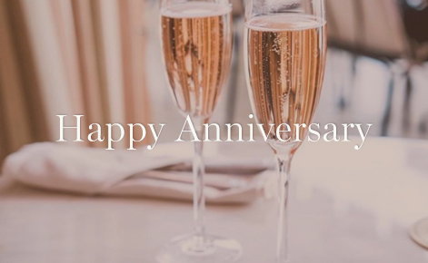 Gift card image of two full Champaign glasses with the text “Happy Anniversary”