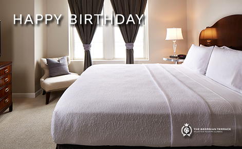 Image of hotel room with the text “Happy Birthday” and The Georgian Terrace logo