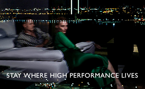 eGift Card image of couple in hotel room looking out over the night sky with the text 