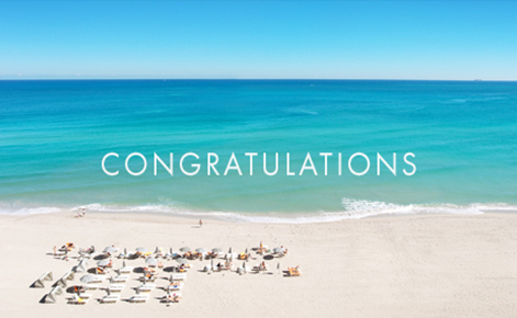 Gift card image of sun loungers on the beach with the text “Congratulations”  