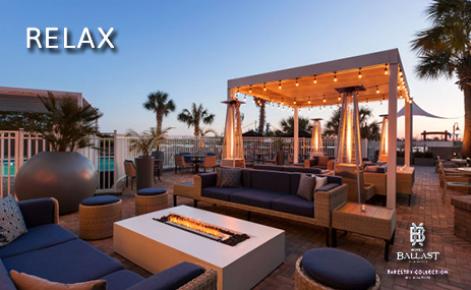 eGift Card image of exterior shot of hotel with the text “Relax”