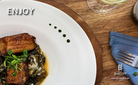 eGift Card image of restaurant meal with the text “Enjoy” and the Hotel Ballast logo