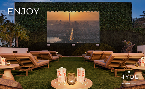 eGift Card image of the roof top cinema at night with the text “Enjoy” and the Hyde Beach House logo