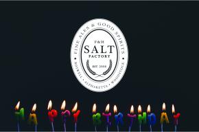 Image of lit candles with Salt Factory Pub logo