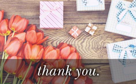 Image of tulips and various sized gifts with the text 