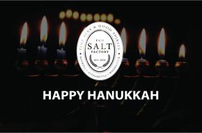 Image of lit Hanukkah candles with the text 