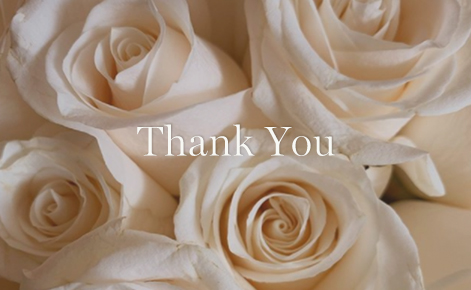 Gift card image of a close up of some white roses and the text “Thank You” 