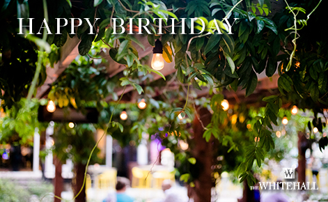 eGift Card image of the foliage from the gardens of the hotel with the text “Happy Birthday” and The Whitehall logo