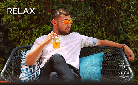 eGift card image of a man relaxing with a drink and the text “Relax” and the Hotel Alba logo