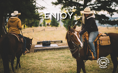 Image of two people on horses with the text 