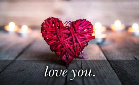 Image of a heart made of red string with the text 