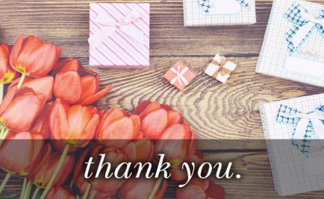 Image of tulips and various sized gifts with the text 