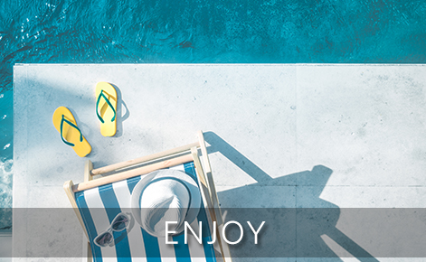 Image of flip flops, deck chair and hat by the pool with the text 