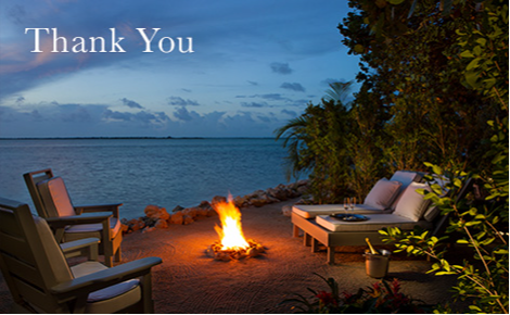 eGift card image of the seating area on beach at night with the text 