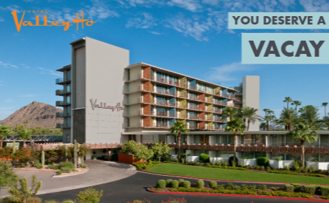 hotel exterior and entrance; text says "You Deserve a Vacay"