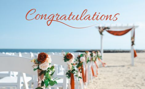 Beach wedding ceremony with Congratulations