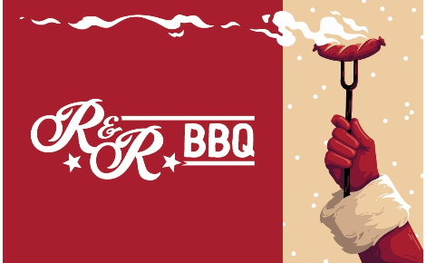 santa's arm holding a sausage on a fork