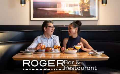 Image of a couple eating dinner at ROGER