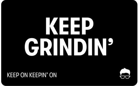 Gift card with bold white text reading 'KEEP GRINDIN'' and the tagline 'Keep on keepin' on' below. A small icon of a face with hair and glasses appears in the bottom-right corner.