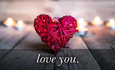 Image of red string heart with the text Love You