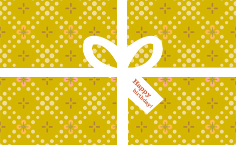 Image of gold wrapped gift with white ribbon