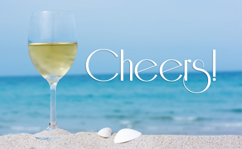 Image of glass of wine on the beach with the text 