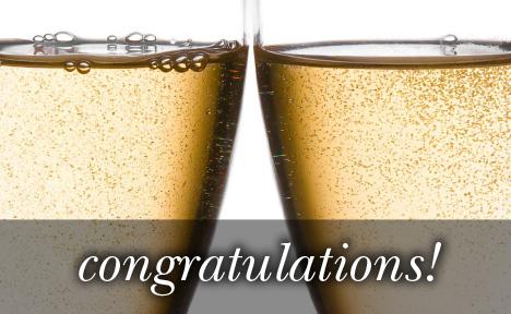 Image of close up on two Champagne glasses touching with the text 