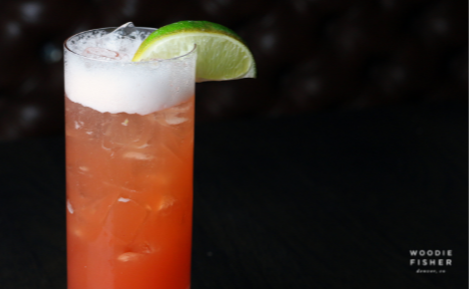 eGift card image of a cocktail and Woodie Fisher Kitchen & Bar logo