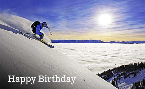Gift card image of skier coming down the mountain with the text “Happy Birthday