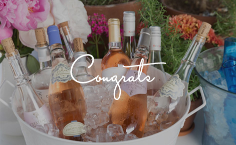 Gift card image of champaign in an ice bucket with the text “Congrats”