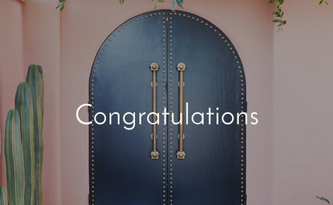 Gift card image of an interior door of the hotel with the text “Congratulations”