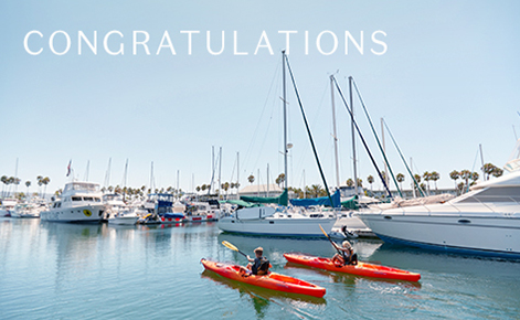 Gift card image of two kayakers in the marina with the text “Congratulations” 
