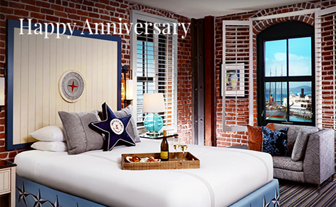 Gift card image of hotel room with the text “Happy Anniversary”