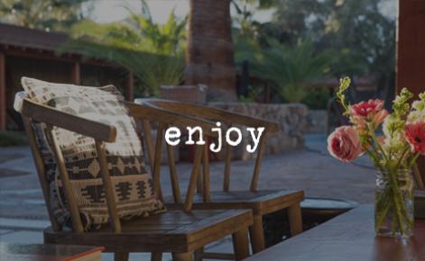 Gift card image of indoor seating area by the window with the text “Enjoy”