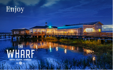 eGift card image of the Wharf restaurant at night with the text “Enjoy” and the Wharf restaurant logo
