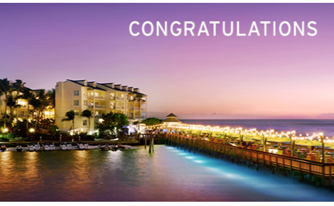 eGift card image of the resort at dusk with the text 