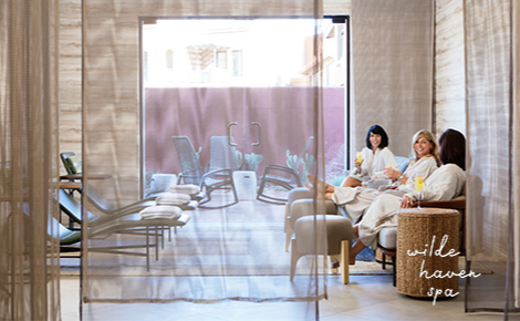 eGift card image of guests relaxing at the spa and the Wilde Spa logo