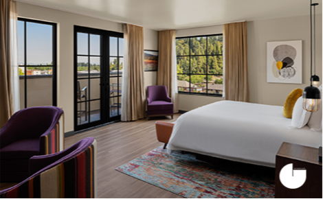 eGift card image of a 7th floor west suite bedroom with The Gordon Hotel logo