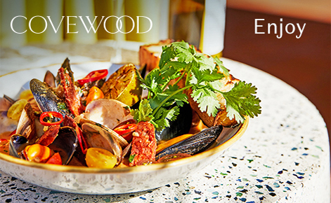 Gift card image of a seafood dish from the restaurant with the text “Enjoy” and the Covewood logo