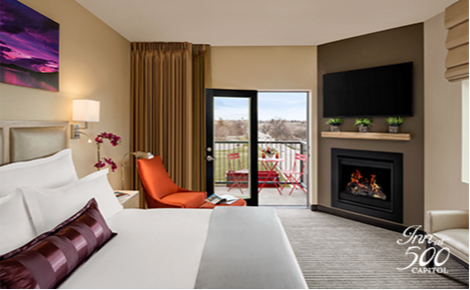 eGift card image of the premier king suite with balcony and the Inn at 500 Capitol logo